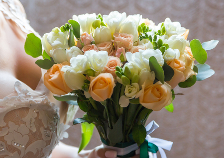 wedding bouquet bride behind. Bride holds beautiful.の写真素材