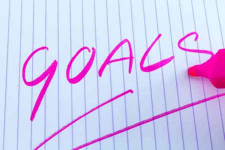 goals keyword written on line paper with pink markerの写真素材