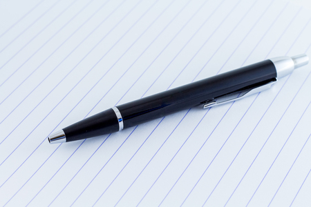 writing pen on writing paper with linesの写真素材