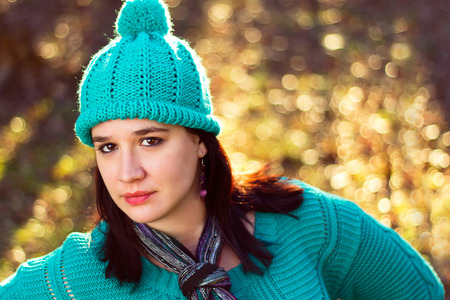 A portrait of a stylish and beautiful woman in matching hat and sweater.の写真素材