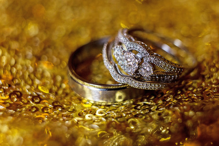 Wedding rings stacked on beautiful background 3の写真素材