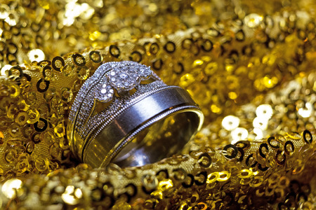 Wedding rings stacked on beautiful background 4の写真素材