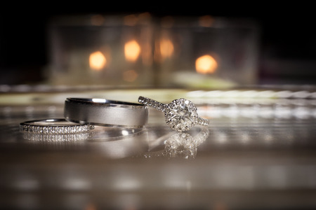 Wedding rings stacked on beautiful backgroundの写真素材
