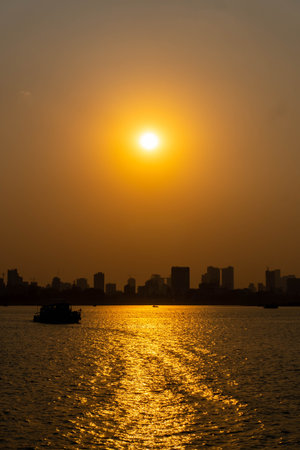 Vibrant orange sunset caught from a sunset boat in phnom penh.の写真素材