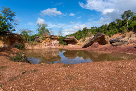 Lake with rocks around in the countryside of Vientiane, Laos.の写真素材