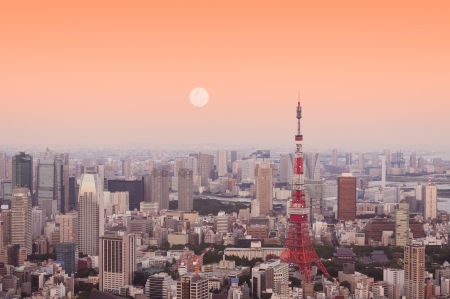 Tokyo Tower at dusk with the moon rising.のeditorial素材