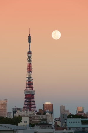 Tokyo Tower at dusk with the moon rising.のeditorial素材