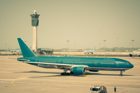 A plane taxis along the runway, getting ready for takeoff のeditorial素材