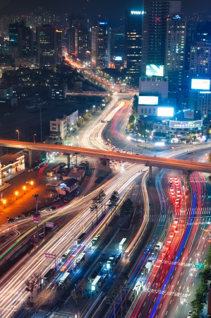 Night traffic blurs past Seoul Station in Seoul, South Korea のeditorial素材