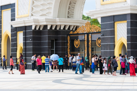 Tourists crowd outside the gate of the new Istana Negara, which is the royal residence of the Yang di-Pertuan Agong  supreme ruler  of Malaysia  Photo taken December 27, 2013 in Kuala Lumpur, Malaysia のeditorial素材
