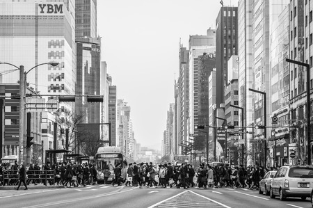 Pedestrians cross the street near Gangnam Station on February 22, 2014 in Seoul, South Korea.のeditorial素材