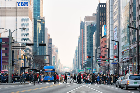 Pedestrians cross the street near Gangnam Station on February 22, 2014 in Seoul, South Korea のeditorial素材