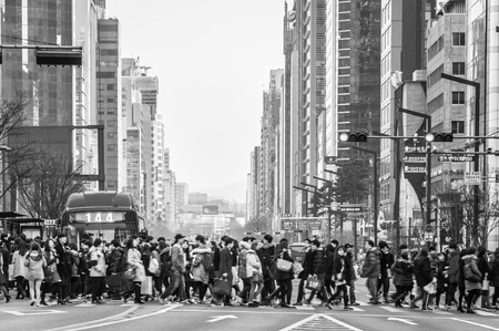 Pedestrians cross the street near Gangnam Station on February 22, 2014 in Seoul, South Korea のeditorial素材