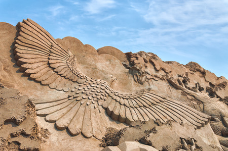An eagle spreads its wings at the Busan Sand Festival in Busan, South Korea.のeditorial素材