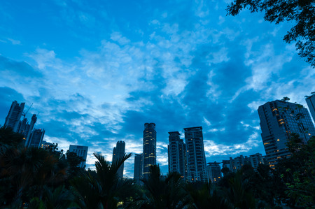 The sun coming up over the skyscrapers of Kuala Lumpur の写真素材