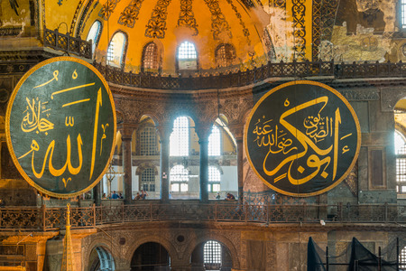 Large Islamic roundels hang from the walls of the Hagia Sophia  のeditorial素材