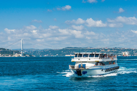 A ferry ship passes along the Bosphorus with the Istanbul skyline in the background.のeditorial素材