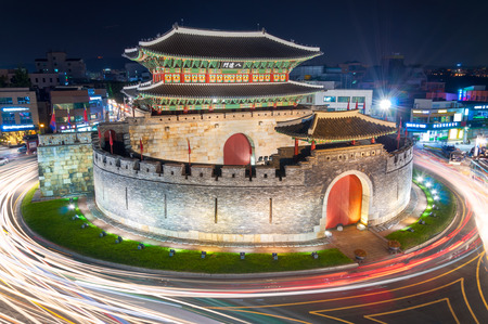 Late night traffic blurs past Paldalmun Gate in Suwon, South Korea.のeditorial素材