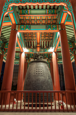 A giant bell hangs within a pavilion at Hwaseong Fortress in Suwon, a large city just outside of Seoul, South Korea.のeditorial素材