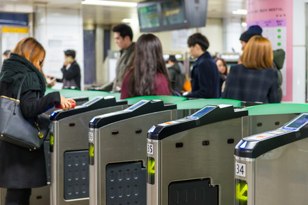 Local Seoulites swipe their metro cards at Gangnam Station on December 21, 2014 in Seoul, South Korea.のeditorial素材