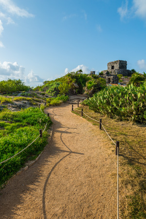 The ancient Mayan ruins of Tulum sit atop the cliffs of Tulum, Mexico, overlooking the Caribbean sea.の写真素材