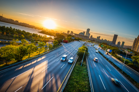 The sun rises over Seoul, South Korea, as people commute to work. The sun rises over Seoul, South Korea, as people commute to work.