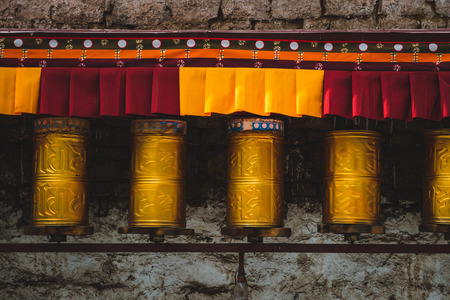 Prayer wheels along the walls of Potala Palace in Lhasa, Tibet.のeditorial素材