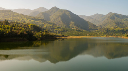 Mountain light reflection on waterの写真素材