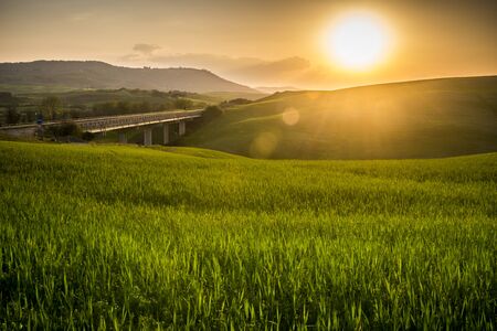 beautiful panorama of sunset in the Tuscany Hills.の写真素材