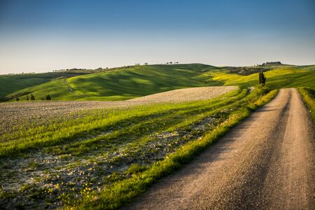 beautiful panorama of sunset in the Tuscany Hills.の写真素材