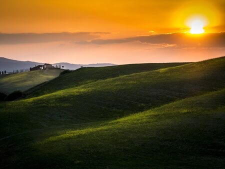 beautiful panorama of sunset in the Tuscany Hills.の写真素材