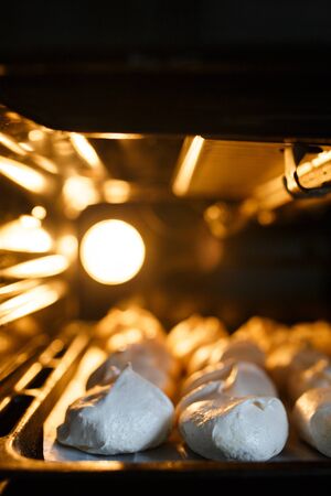 Sweet white bizet baking in the oven. Homemade food