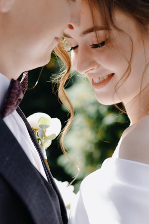 Portrait of the bride and groom on a walk in the forest. Close-up. Hgh quality photoの写真素材