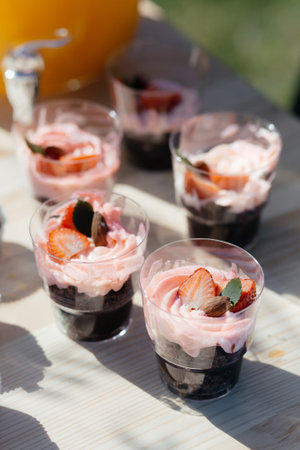 Pink Frosted Cupcakes with a Strawberry on Top