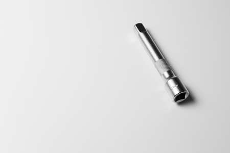 The socket wrench lies on a white tableの写真素材