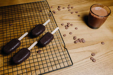 Beautiful candy bar decoration, cake in the form of ice cream with chocolate. Preparation of...