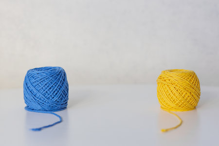 Close-up of yellow and blue balls placed at different angles with space in between