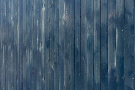 Blue wooden facade of a modular house close-up