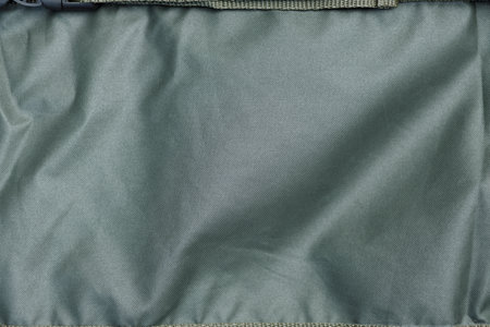 A close up image of the jackets sleeve reveals a grey lining with aqua tints and shades. The lining...