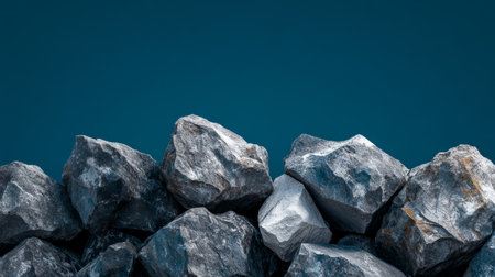 A striking view from above showcases a rugged cliff's rocky edge, contrasting sharply with the vast expanse of deep blue sky above. The natural formations create an awe-inspiring scene.の素材