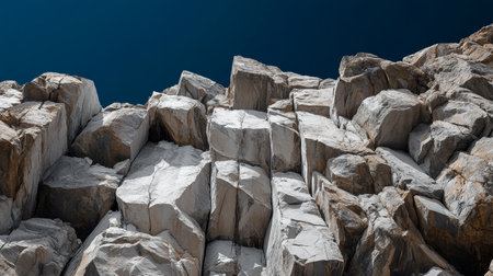 Rocky cliff edge extends towards an endless blue sky at midday. Generative AIの素材