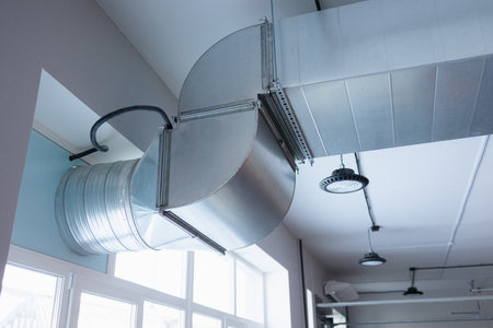 Steel ductwork creates an industrial atmosphere in a modern workspace