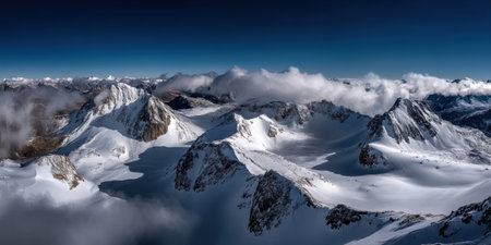 Towering mountain peaks, capped with glistening snow, contrast vividly with the azure sky. Wispy clouds drift lazily, enhancing the serene atmosphere of this untouched wilderness.の素材