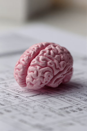 A brain-shaped eraser rests on a formula sheet, creatively merging education and imagination. This artistic depiction invites viewers to contemplate the connection between knowledge and creativity.の素材
