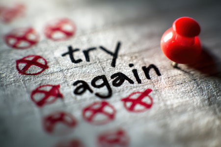 Handwritten notes blend creativity and motivation, showcasing red-crossed answers paired with words urging to try again, fostering resilience and determination to improve and succeed.の素材