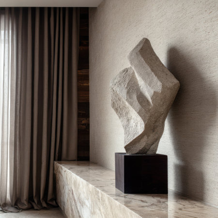 An exquisite abstract stone sculpture rests prominently on a marble pedestal within a serene modern interior. Soft neutral tones create a harmonious atmosphere, showcasing artistic elegance.の素材