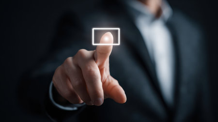 A focused individual in a suit engages with a virtual interface, showcasing the blend of technology and professional life.の素材