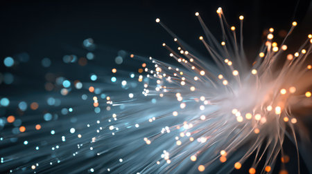 Fiber optic cables radiate vibrant light, capturing the essence of high-speed data transmission in a clean, abstract setting.の素材