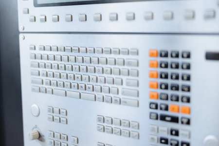This control panel features a variety of buttons and keys, designed for operating complex machinery efficiently.の写真素材