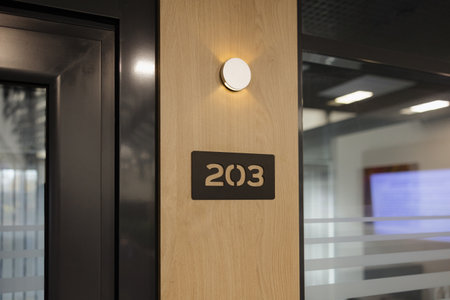 Room 203 offers a sleek design, featuring warm wood textures and bright lighting, perfect for...